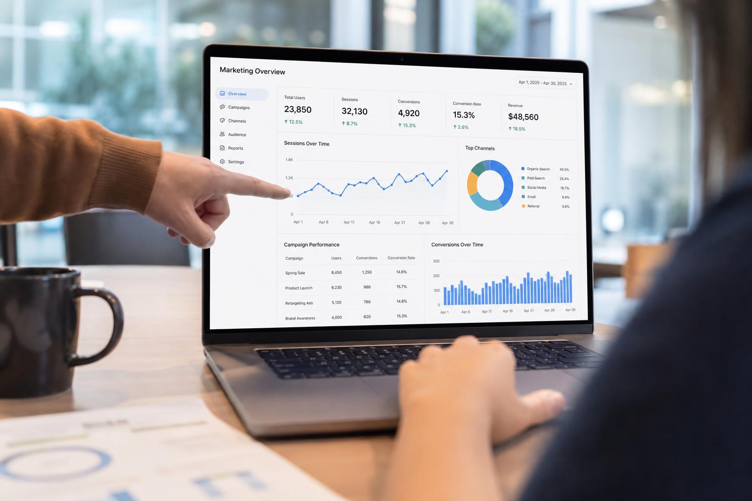 Open notebook with handwritten notes next to analytics printouts
