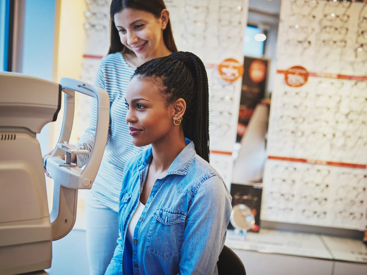 Patient receiving an eye exam in an optical shop — vision care marketing agency Louisville KY