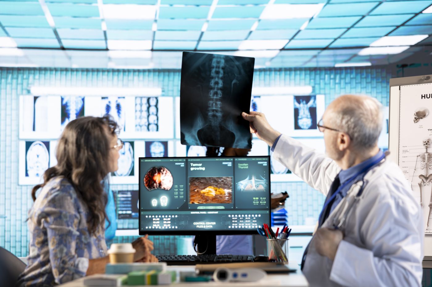Doctor reviewing a patient X-ray with a senior patient