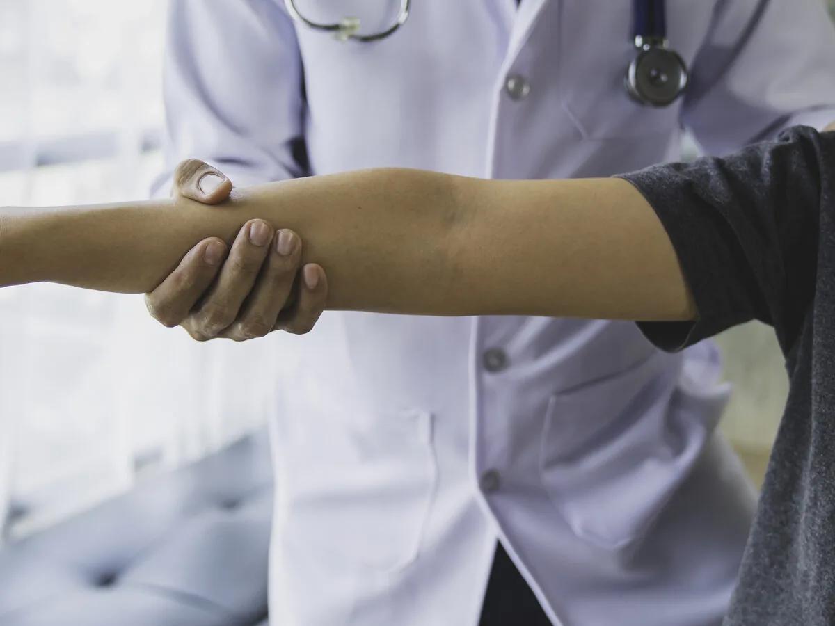 Orthopedic physician examining a patient during a consultation