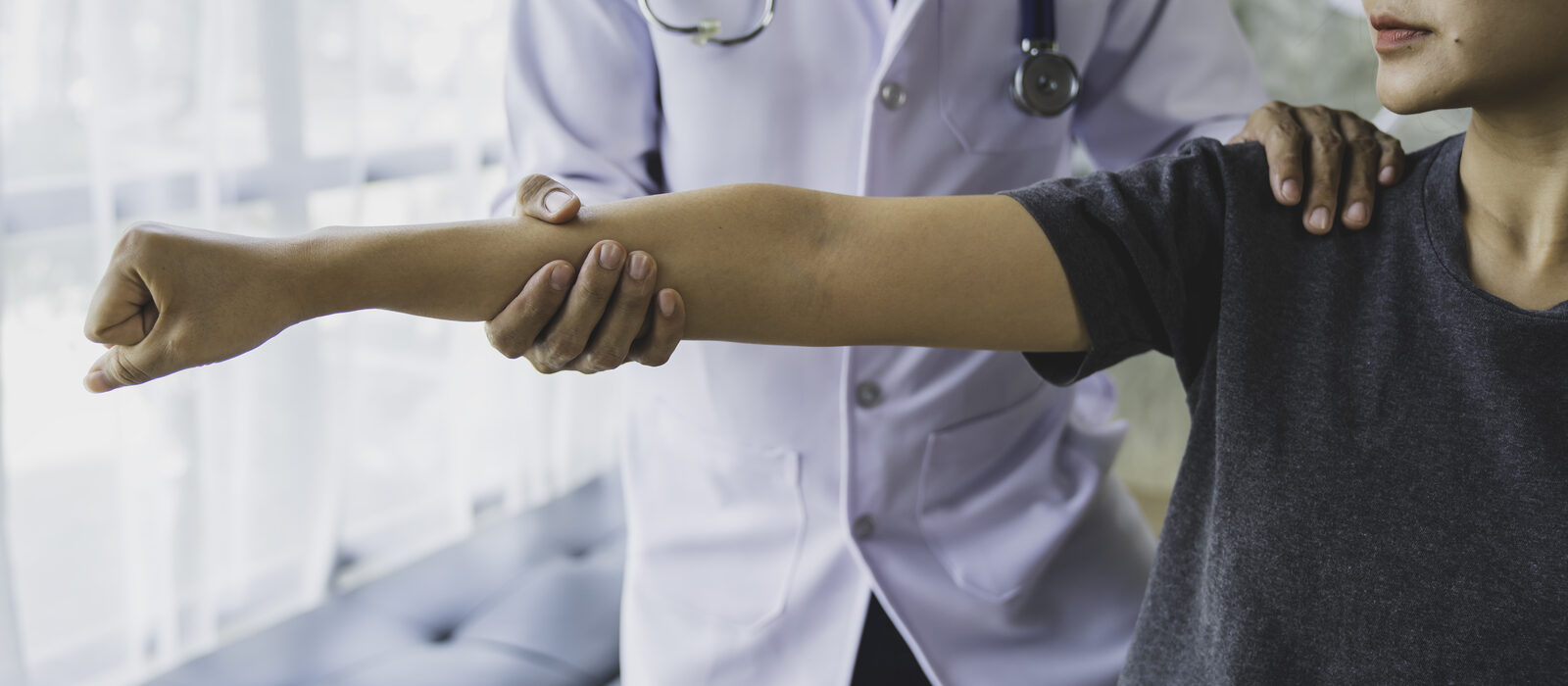 Pain management physician counseling a patient about chronic pain
