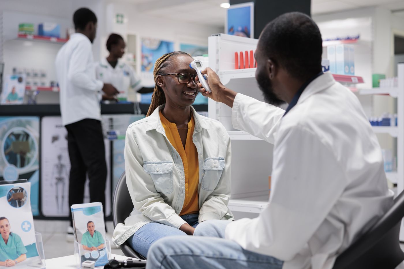 Temperature check at a pharmacy counter with a digital thermometer